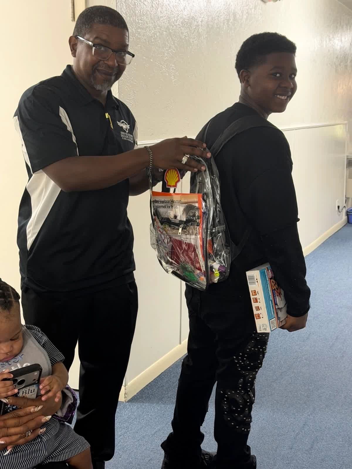 Delightful Days volunteer presenting gift bag to smiling community member