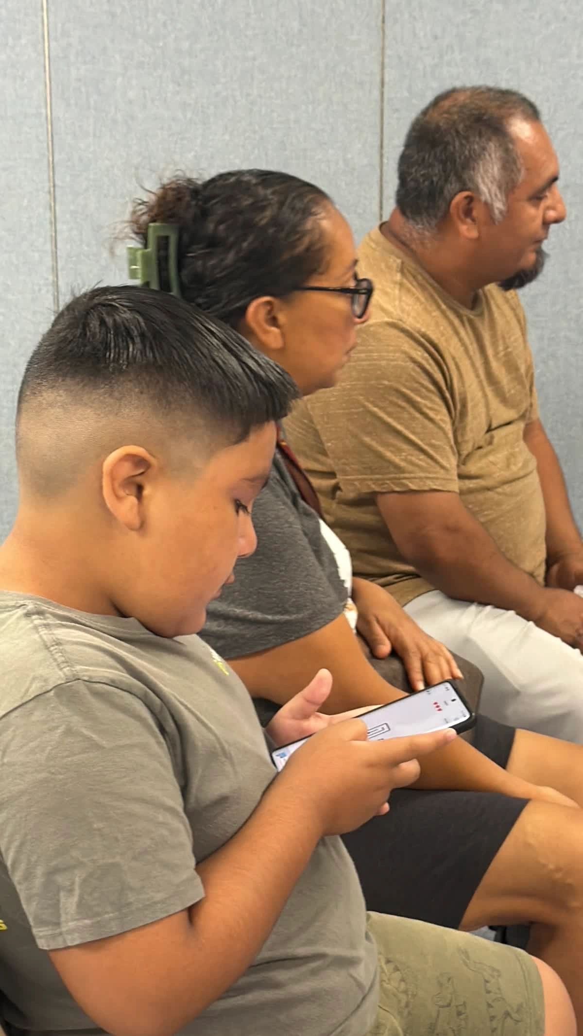 Family playing video game together at Delightful Days event