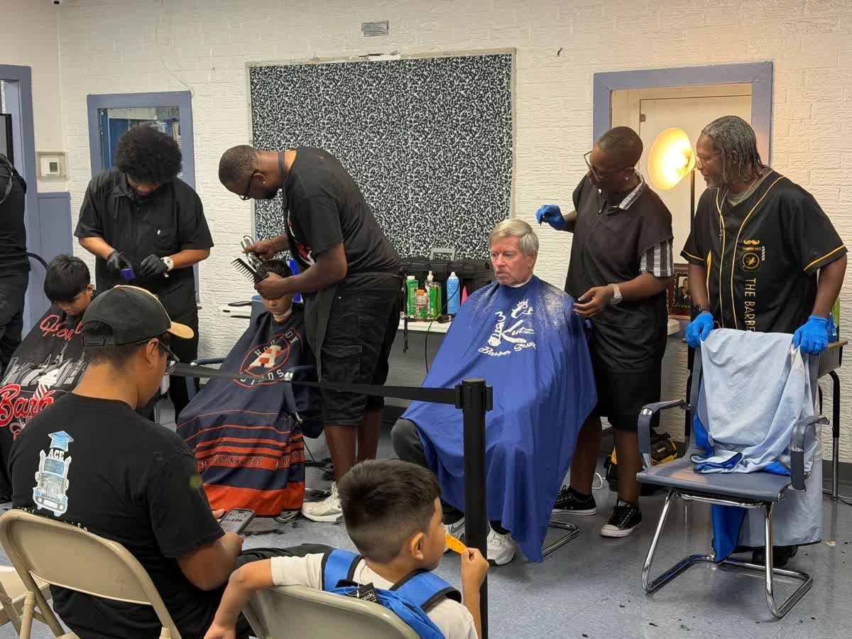 Barbers giving free haircuts at Delightful Days community event
